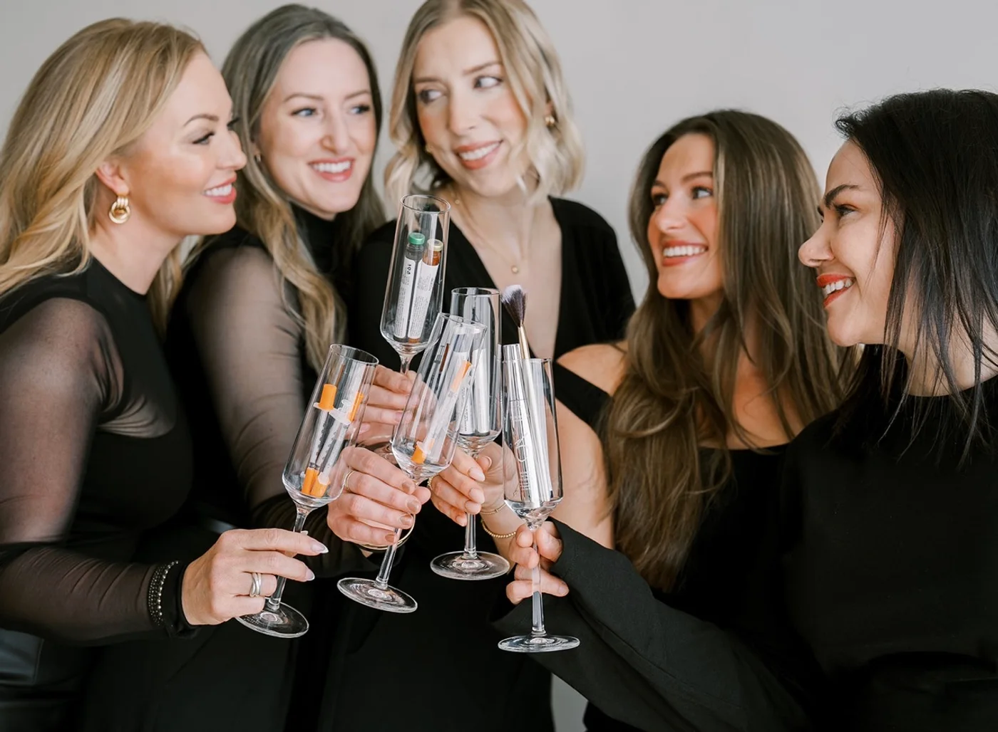 The NECTAR body•face•skin team toasting five years together in DeWitt MI
