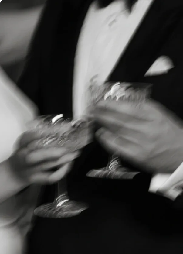 Bride and groom champagne toast, celebrating natural-looking wedding skin from NECTAR body face skin